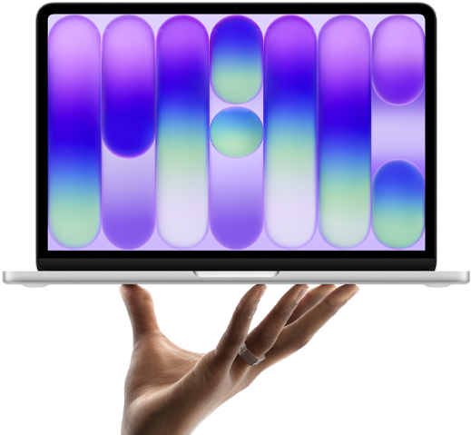 MacBook Neo color argento in equilibrio sulla punta delle dita di una mano aperta, lo schermo mostra un motivo astratto colorato